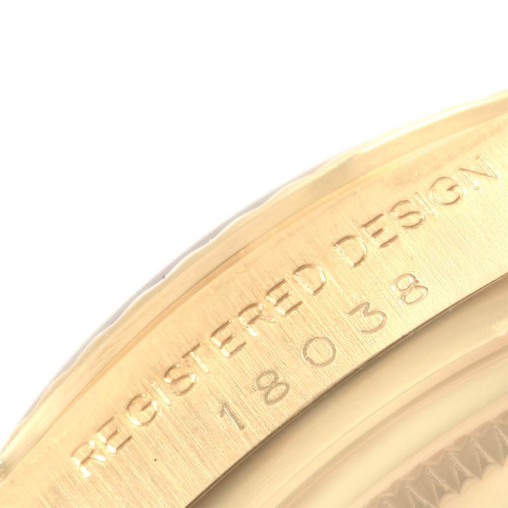 Close-up of the Rolex Vintage Collection 18038 Men's Yellow Gold Silver Dial 18038 Men's Yellow Gold Silver Dial model showing the "REGISTERED DESIGN 18038" engraving on the case.
