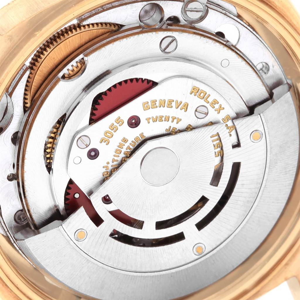 The image shows a close-up of the internal movement mechanism of a Rolex Vintage Collection 18038 Men's Yellow Gold Silver Dial 18038 Men's Yellow Gold Silver Dial model, highlighting gears and inscriptions.