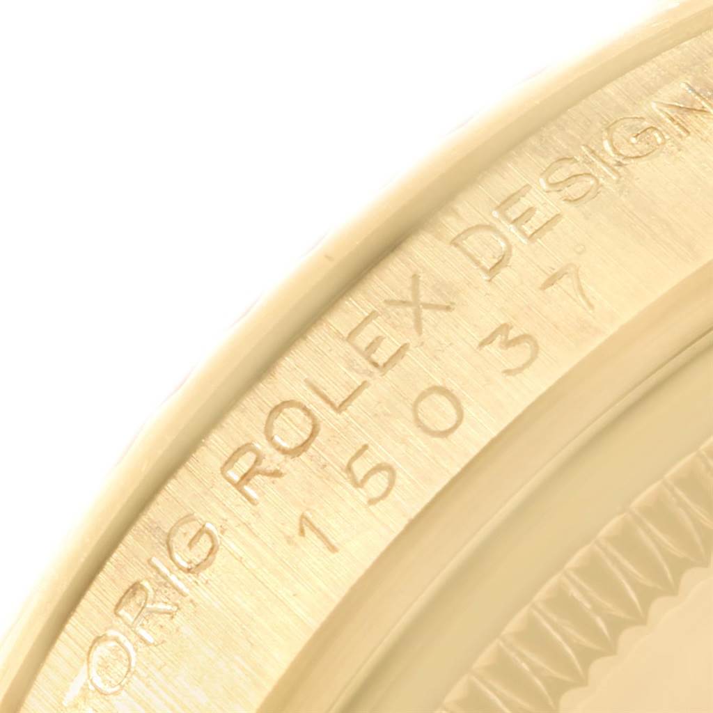 The image shows a close-up of the case side of a Rolex Vintage Collection 15037 Men
s Yellow Gold Champagne Dial 15037 Men
s Yellow Gold Champagne Dial watch, revealing the model number 15037.