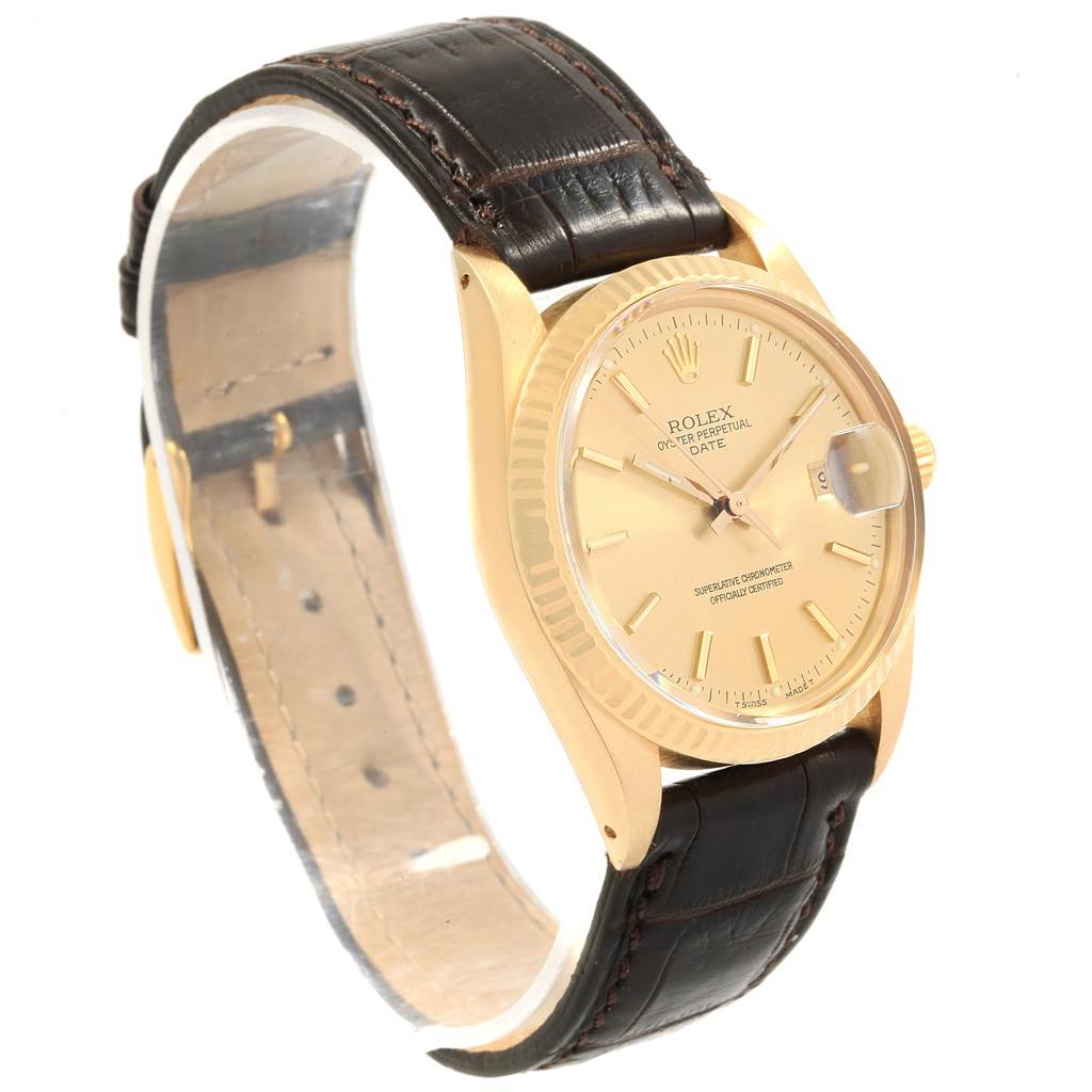 The Rolex Vintage Collection 15037 Men
s Yellow Gold Champagne Dial 15037 Men
s Yellow Gold Champagne Dial model watch is shown at a three-quarter view highlighting the gold case, dial, and brown leather strap.