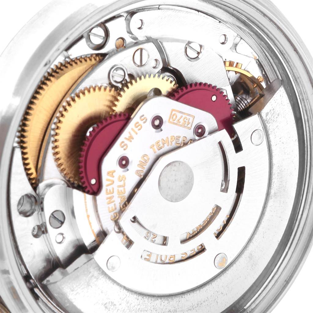 This image shows a close-up of the internal mechanical movement and gears of a Vintage Collection model by Rolex.