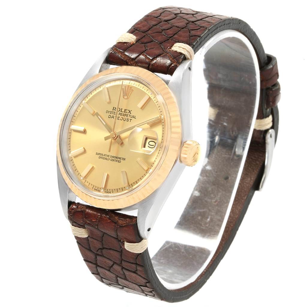 The image shows a Rolex Vintage Collection 1601 Men's Steel and Gold (two tone) Champagne Dial 1601 Men's Steel and Gold (two tone) Champagne Dial Oyster Perpetual Datejust watch at an angle displaying the dial, bezel, crown, and leather strap.