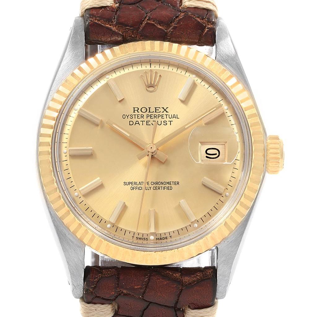 The image shows a front view of the Rolex Vintage Collection 1601 Men's Steel and Gold (two tone) Champagne Dial 1601 Men's Steel and Gold (two tone) Champagne Dial model with a gold dial, fluted bezel, and brown leather strap.