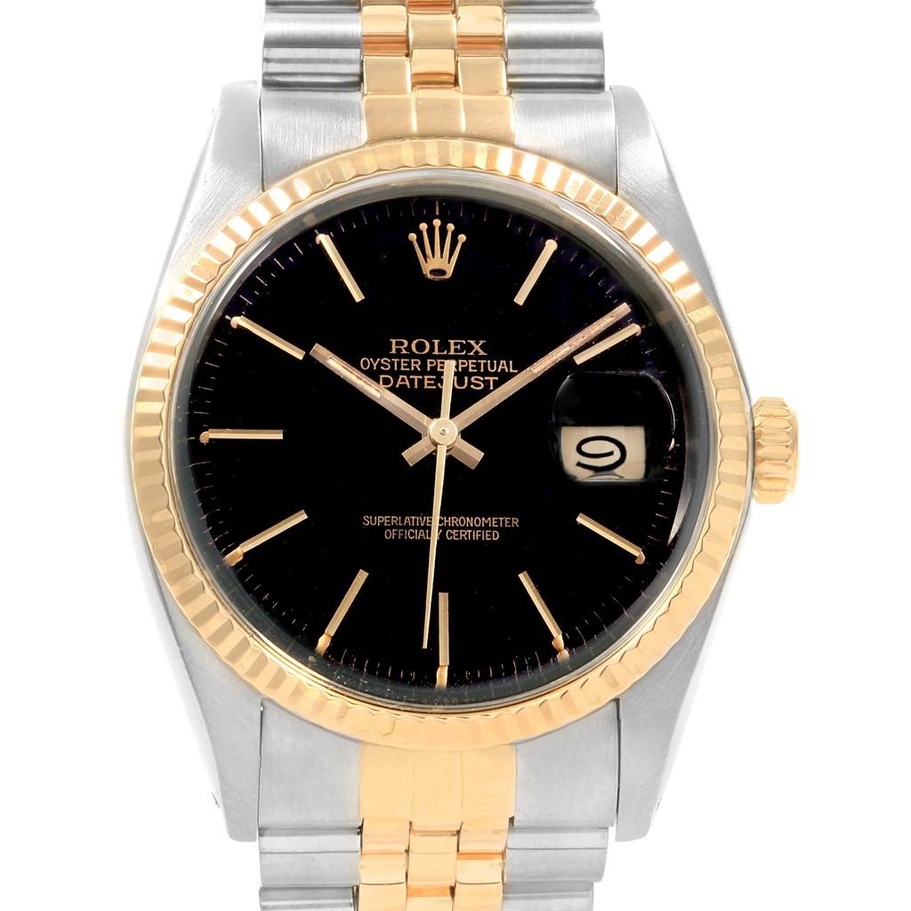 The image shows a Rolex Vintage Collection 16013 Men's Stainless Steel Black Dial 16013 Men's Stainless Steel Black Dial model watch, featuring a black dial, gold bezel, and a two-tone gold and silver bracelet.