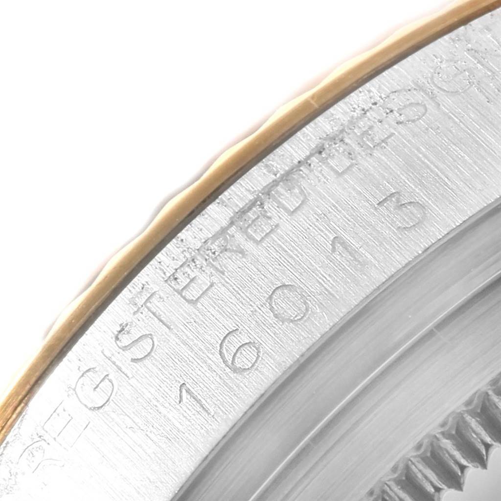 This image shows a close-up of the engraved bezel and edge of the dial of a Rolex Vintage Collection 16013 Men's Stainless Steel Black Dial 16013 Men's Stainless Steel Black Dial watch.