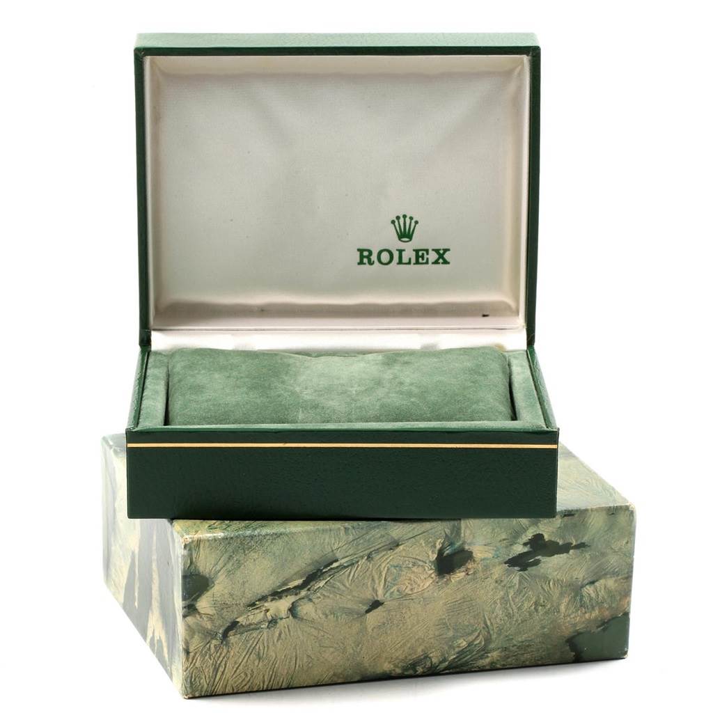 This image shows an open green Rolex Vintage Collection 16013 Men's Stainless Steel Black Dial 16013 Men's Stainless Steel Black Dial watch box with a cushioned interior, revealing no accessories.