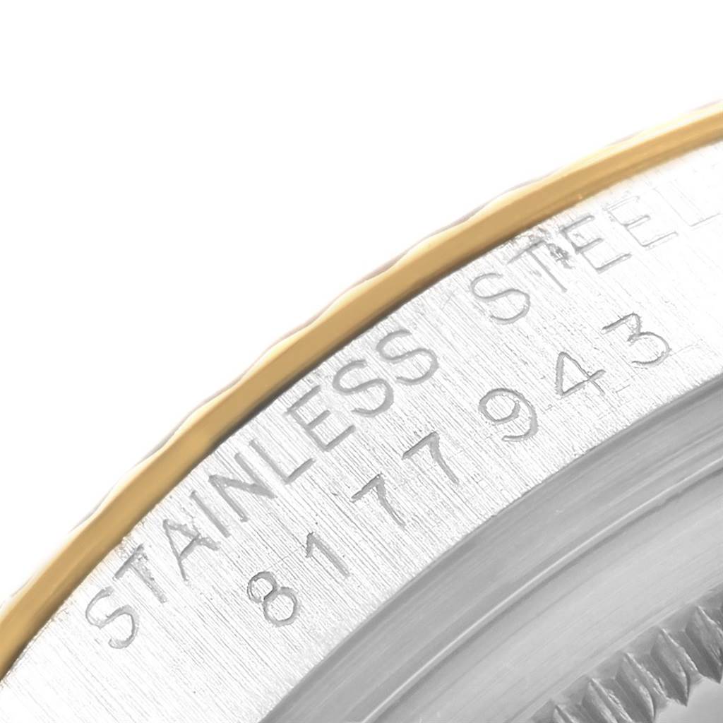 The image shows a close-up of the side engraving on the bezel of a Vintage Collection Rolex watch.