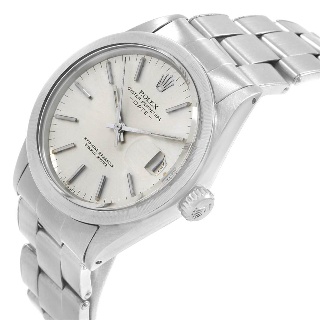 This image shows a Rolex Vintage Collection 1501 Men's Stainless Steel Silver Dial 1501 Men's Stainless Steel Silver Dial watch from an angled side view, highlighting the face, crown, and part of the bracelet.