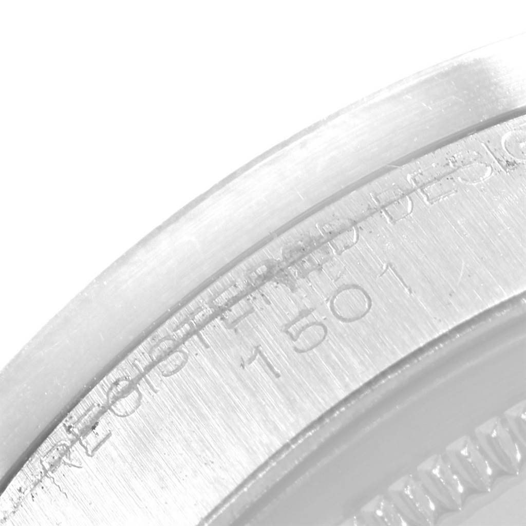This close-up angle shows the engraved serial numbers on the outer case back of the Rolex Vintage Collection 1501 Men's Stainless Steel Silver Dial 1501 Men's Stainless Steel Silver Dial watch.