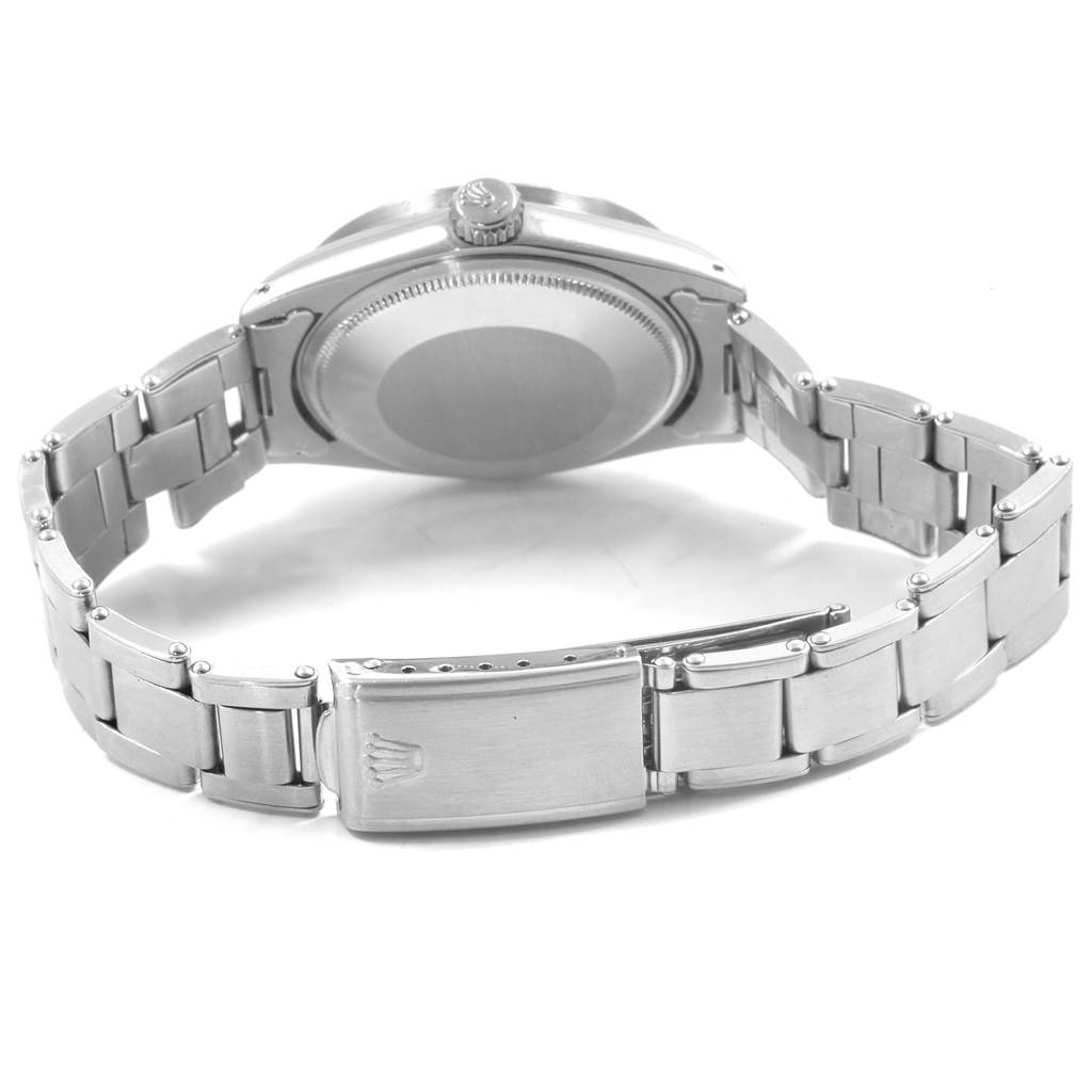 The image shows the back case and bracelet of a Rolex Vintage Collection 1501 Men's Stainless Steel Silver Dial 1501 Men's Stainless Steel Silver Dial watch.