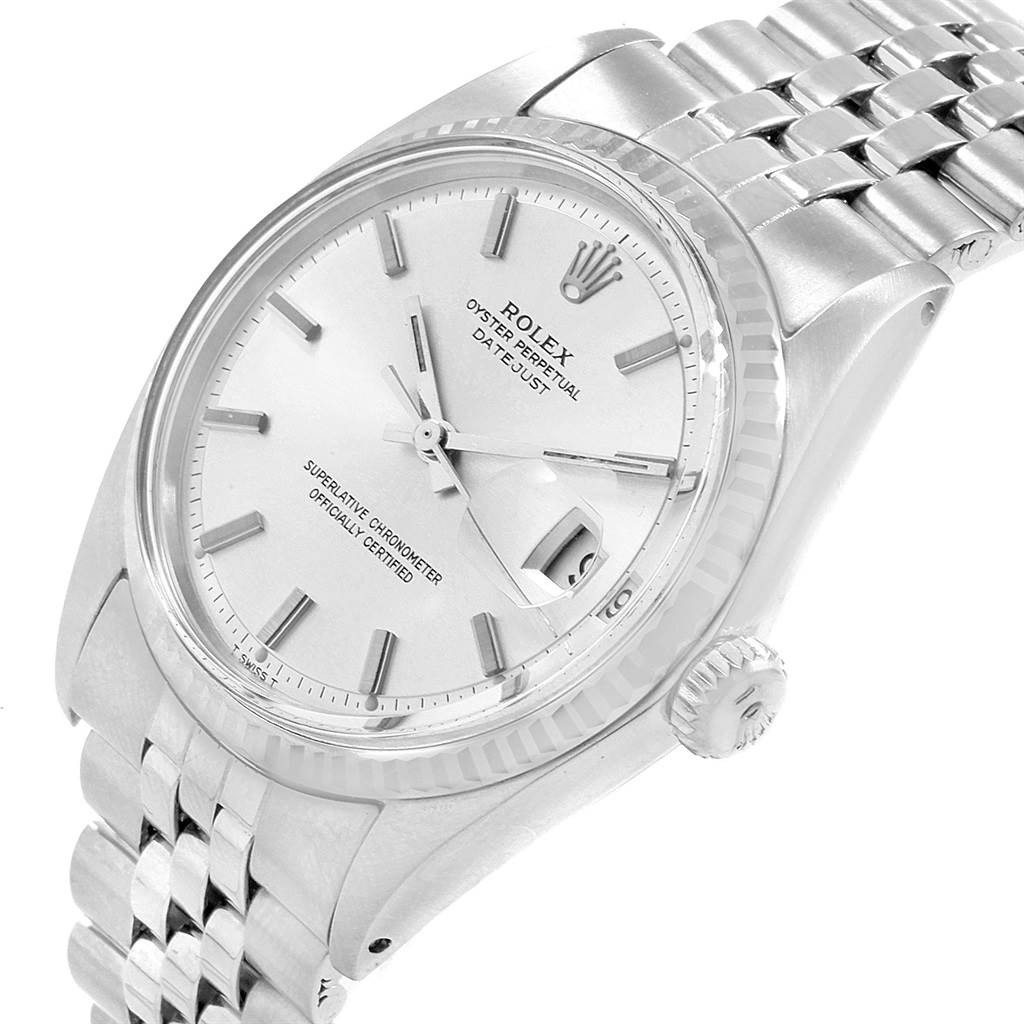 This image shows the dial, bezel, crown, and part of the bracelet of the Rolex Vintage Collection 1603 Men's Stainless Steel Silver Dial 1603 Men's Stainless Steel Silver Dial model watch at an angled view.