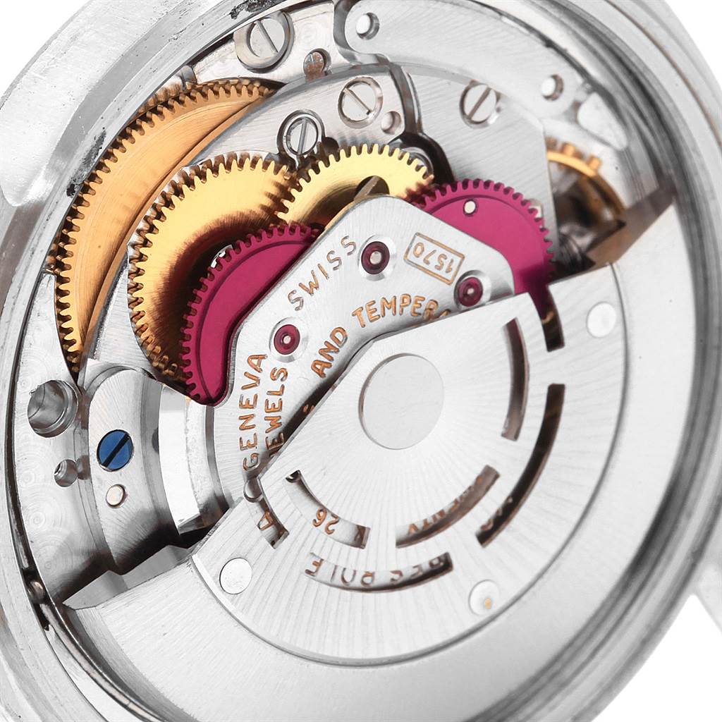 This image shows the intricate inner mechanism of a Vintage Collection Rolex watch at a close-up angle.