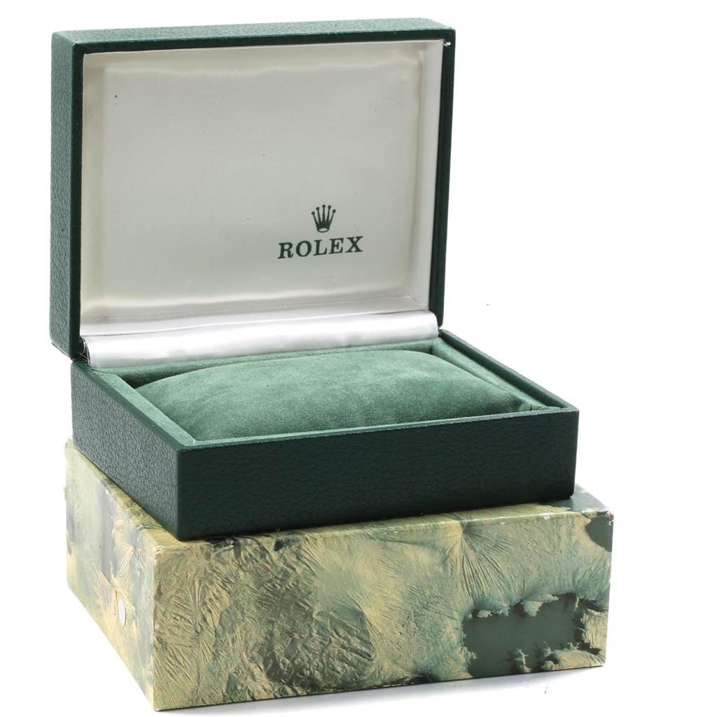 This image shows an open green case for the Rolex Vintage Collection 1603 Men's Stainless Steel Silver Dial 1603 Men's Stainless Steel Silver Dial watch, with a pillow and the Rolex logo visible.