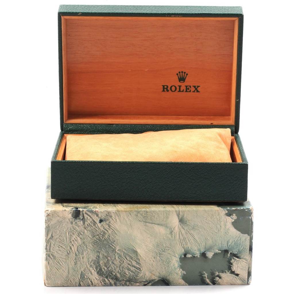 This image shows an open Rolex Vintage Collection 1601 Men
s Yellow Gold Brown Dial 1601 Men
s Yellow Gold Brown Dial watch box, displaying its interior with a cushioned pillow.
