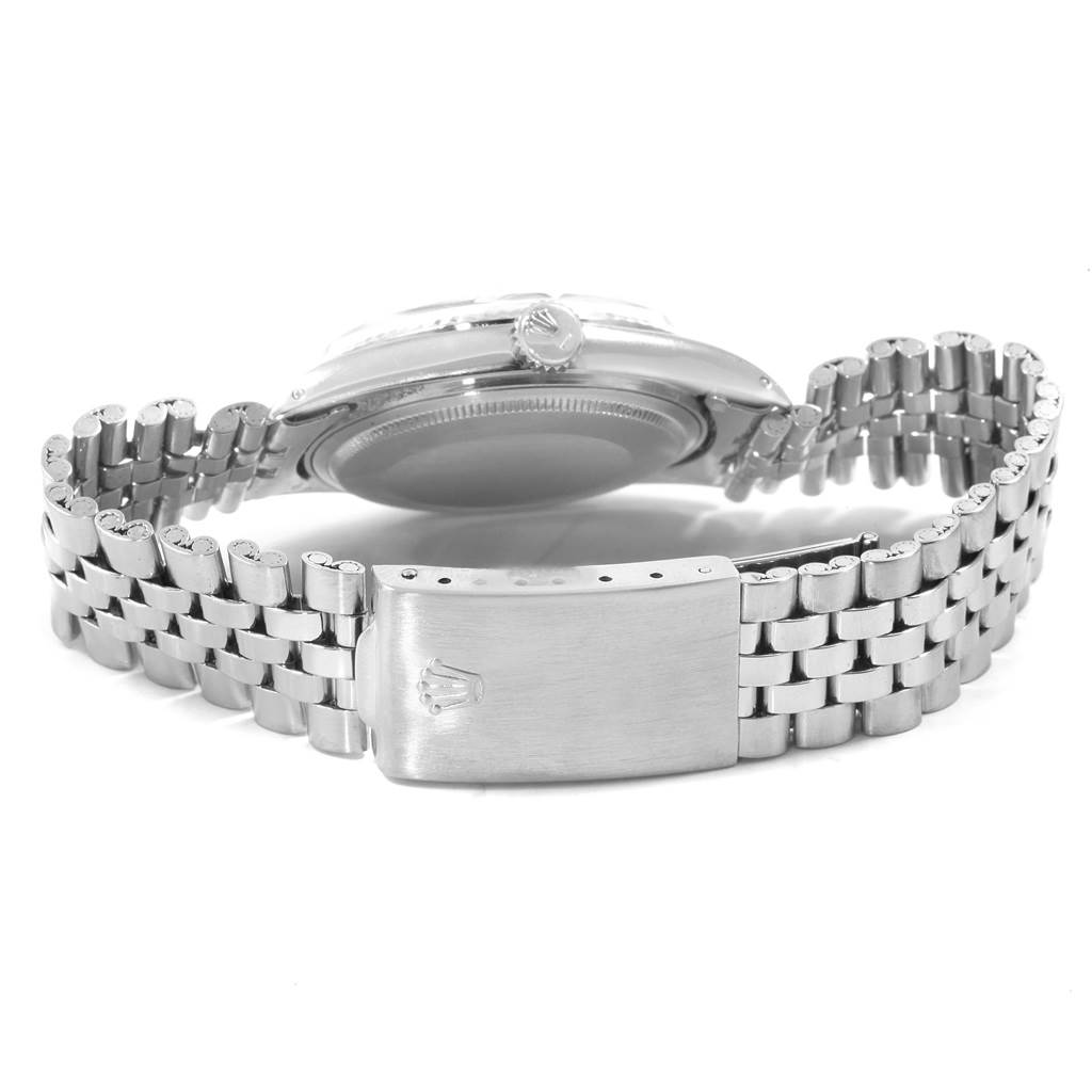 The image features the back view of a Rolex Vintage Collection 1601 Men's Stainless Steel Silver Dial 1601 Men's Stainless Steel Silver Dial watch, showcasing its case, crown, and metal bracelet with clasp.