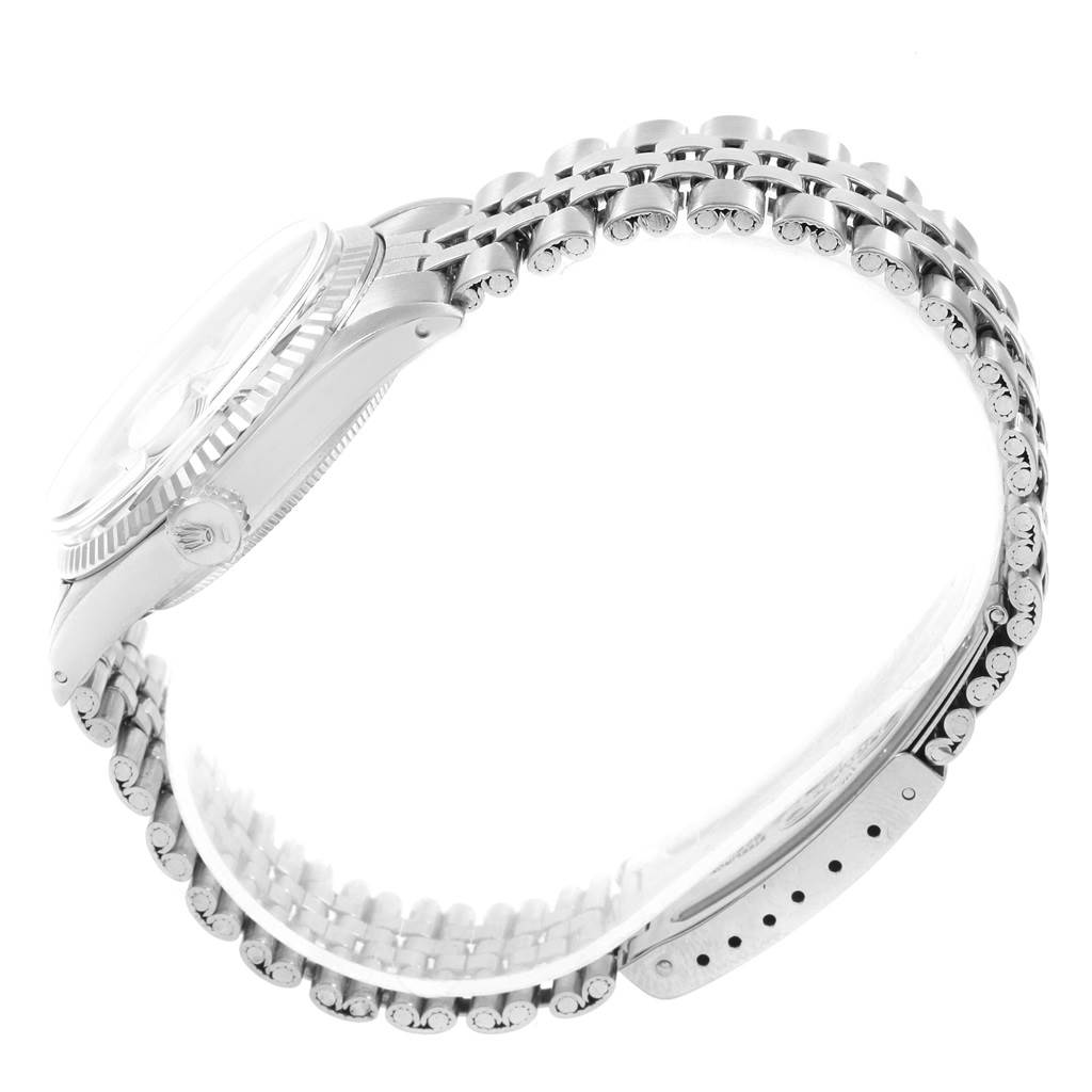 The image shows a side view of the Rolex Vintage Collection 1601 Men's Stainless Steel Silver Dial 1601 Men's Stainless Steel Silver Dial watch, highlighting its bezel and bracelet.