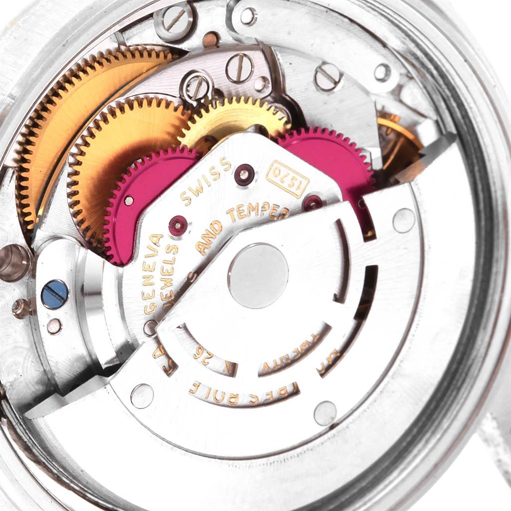 The image shows a close-up view of the intricate inner gears and mechanics of a Rolex Vintage Collection 1601 Men's Stainless Steel Silver Dial 1601 Men's Stainless Steel Silver Dial watch.