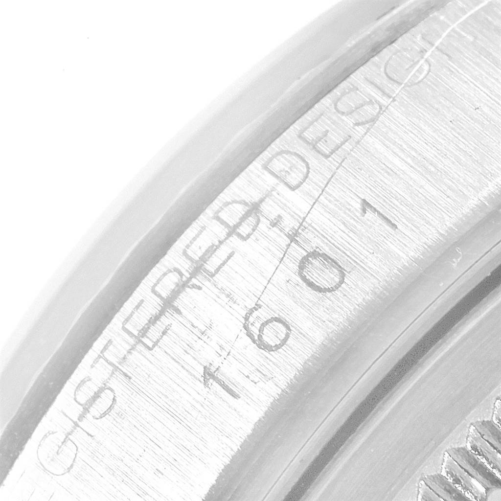 This image shows a close-up of the side view of a Vintage Collection watch by Rolex, displaying part of the serial number inscription.