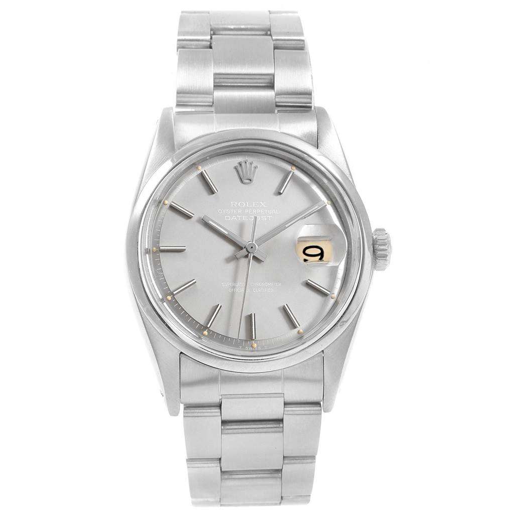 The image shows a frontal view of a Vintage Collection Rolex watch, highlighting its silver dial, date display, and stainless steel bracelet.