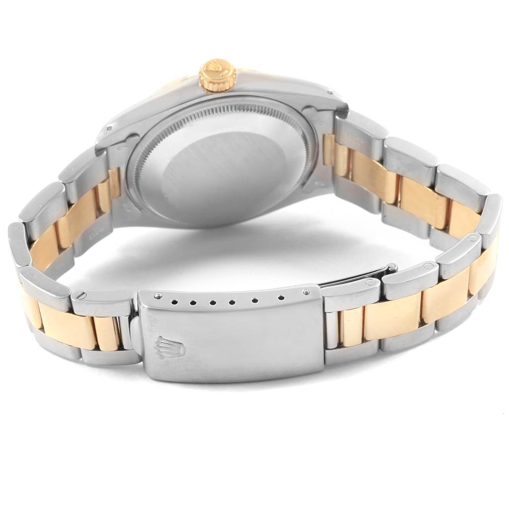 The image shows the back view of the Rolex Vintage Collection 1505 Men's Steel and Gold (two tone) Champagne Dial 1505 Men's Steel and Gold (two tone) Champagne Dial watch, highlighting its two-tone metal band and clasp.