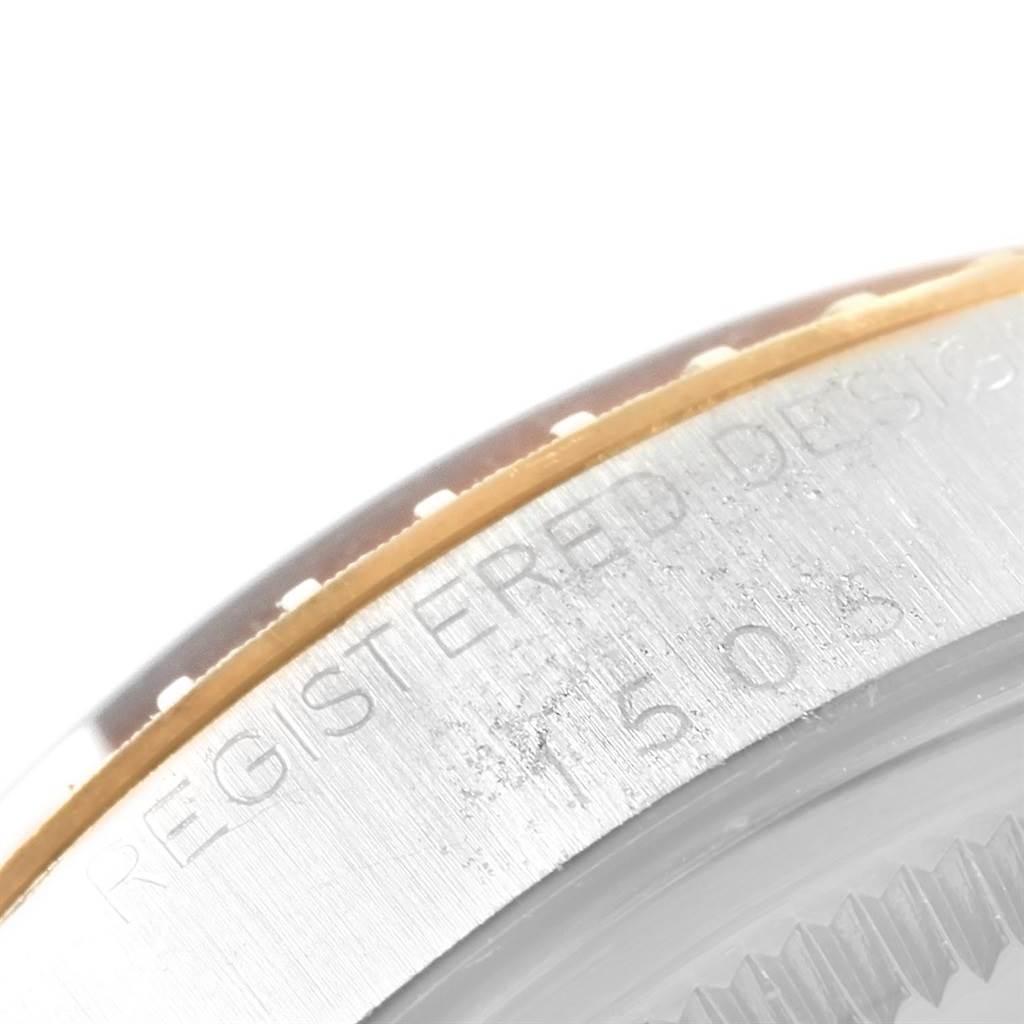 This image shows the side profile of the bezel and engraved case back of a Vintage Collection Rolex watch.
