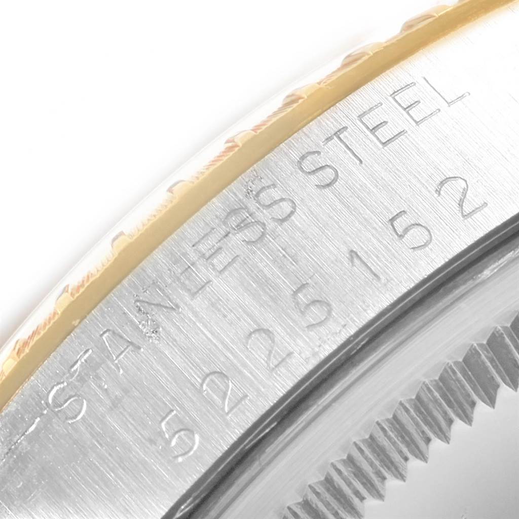 This image shows a close-up of the stainless steel case back and the engraved serial number of a Vintage Collection model by Rolex.