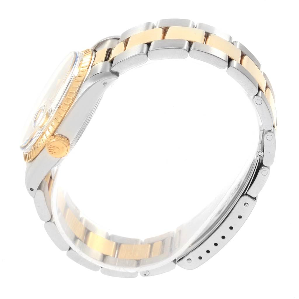 The image shows a side view of the Rolex Vintage Collection 1505 Men's Steel and Gold (two tone) Champagne Dial 1505 Men's Steel and Gold (two tone) Champagne Dial watch, highlighting the case, crown, and two-tone bracelet.