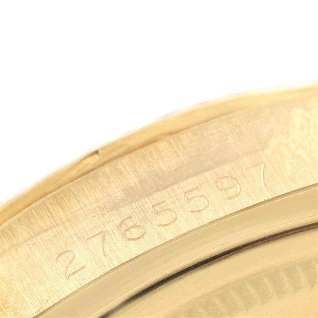 This close-up image shows the engraved serial number on the case of a Vintage Collection model by Rolex.