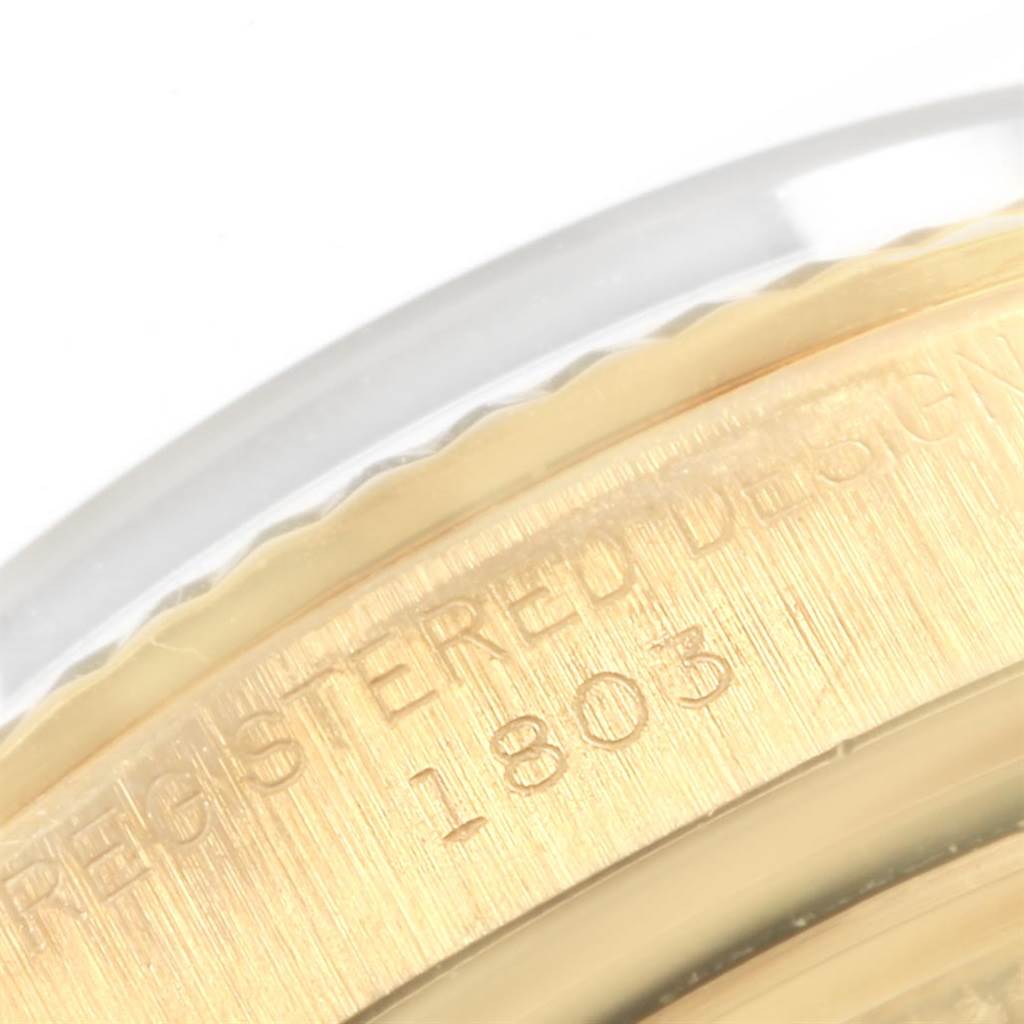 This image shows a close-up of the case back engraving on a Rolex Vintage Collection 1803 Men
s Yellow Gold Black Dial 1803 Men
s Yellow Gold Black Dial model 1803 watch.