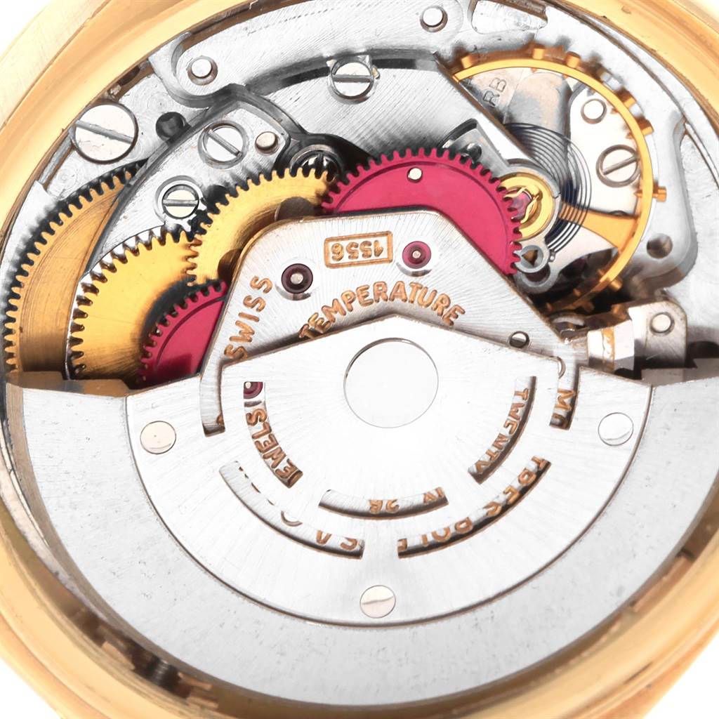 The image shows a close-up of the internal mechanical movement of a Vintage Collection Rolex watch.