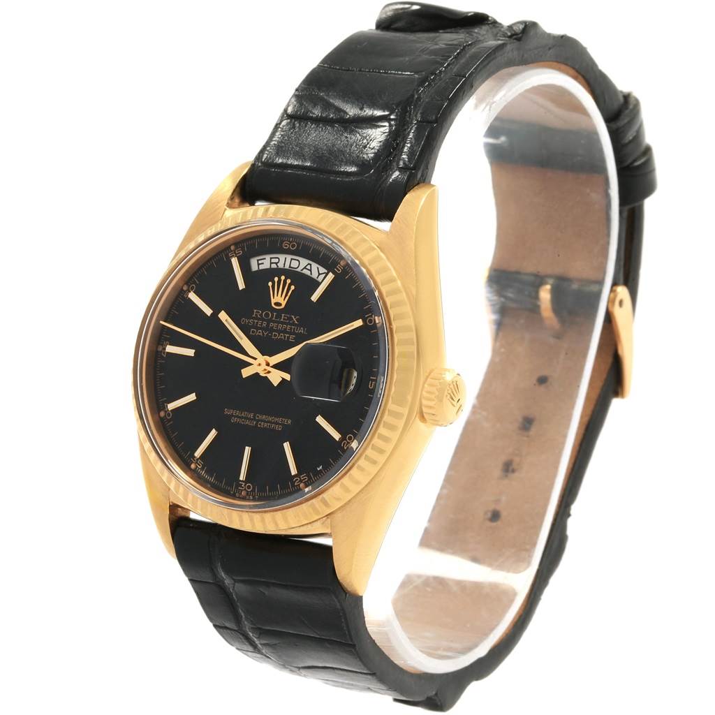 The Rolex Vintage Collection 1803 Men
s Yellow Gold Black Dial 1803 Men
s Yellow Gold Black Dial model is shown from an angle displaying its black dial, gold case, and black leather strap.