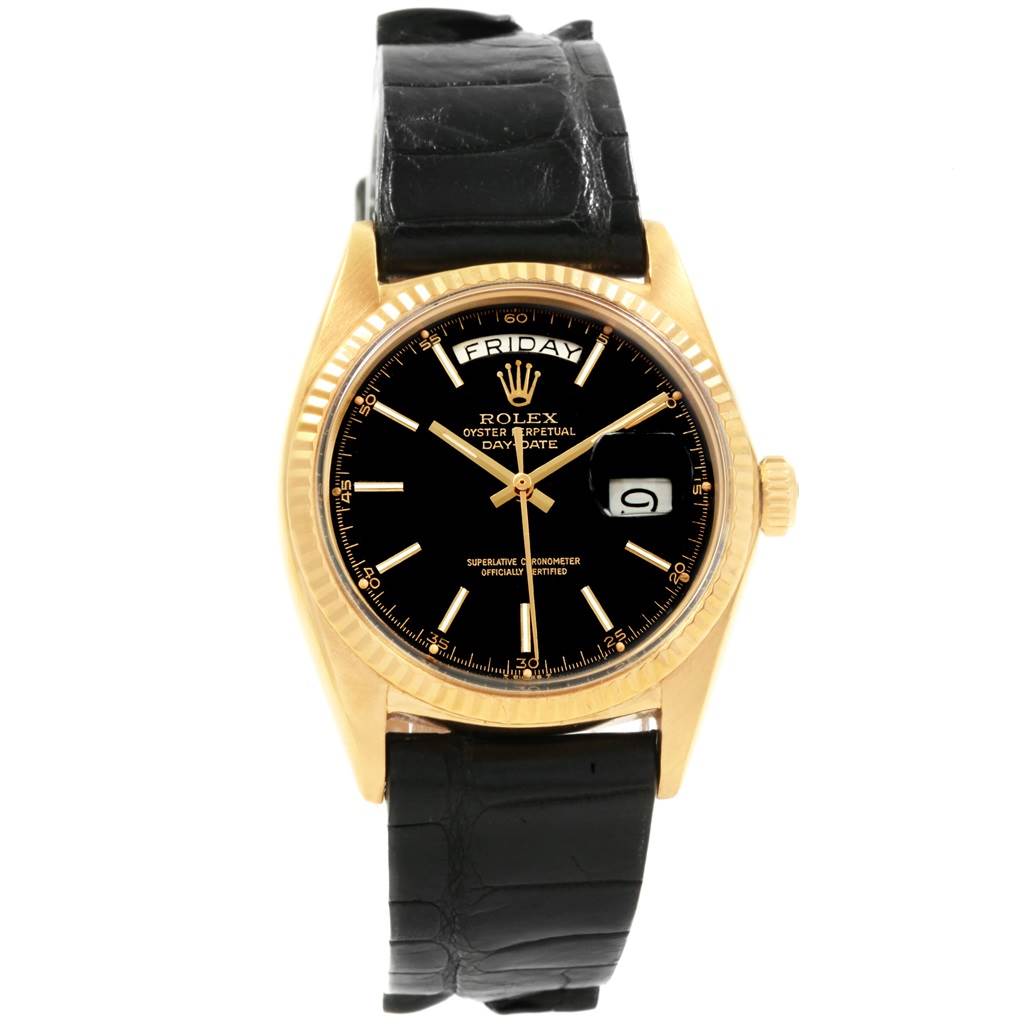 The image shows a front view of the Rolex Vintage Collection 1803 Men
s Yellow Gold Black Dial 1803 Men
s Yellow Gold Black Dial watch, highlighting its black dial, gold case, and black leather strap.