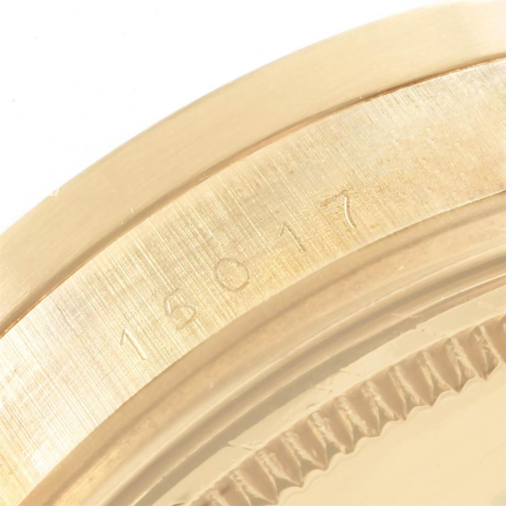 This is a close-up of the edge and caseback part of a Rolex Vintage Collection 15017 Men's Yellow Gold White Dial 15017 Men's Yellow Gold White Dial model watch, showing the reference number 16017.