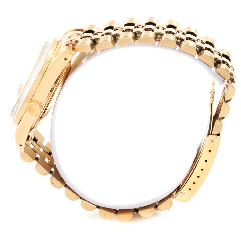 This side view of the Rolex Vintage Collection 15017 Men's Yellow Gold White Dial 15017 Men's Yellow Gold White Dial watch showcases the gold case, bezel, crown, and bracelet.