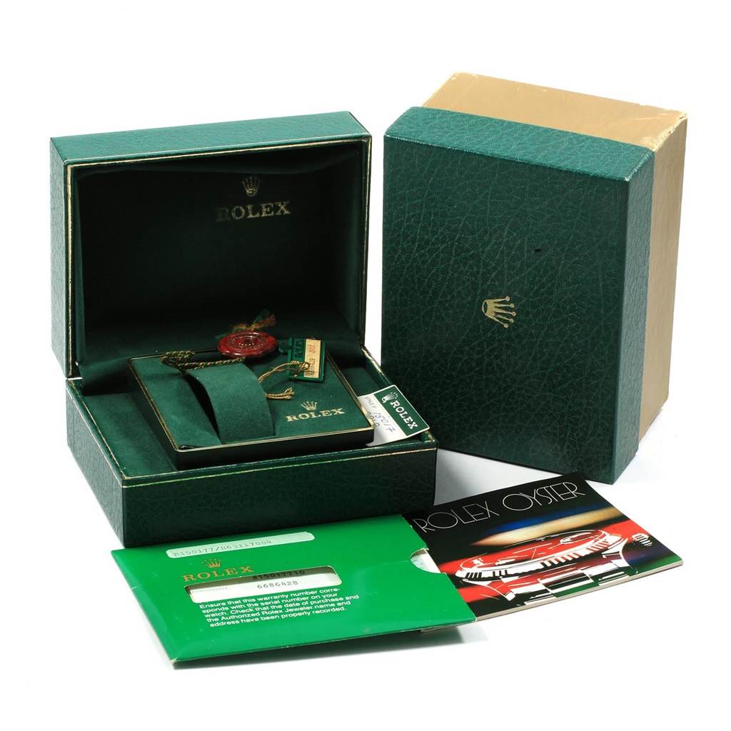 The image shows the packaging and accessories of a Rolex Vintage Collection 15017 Men's Yellow Gold White Dial 15017 Men's Yellow Gold White Dial model, including its box, tags, and documentation.