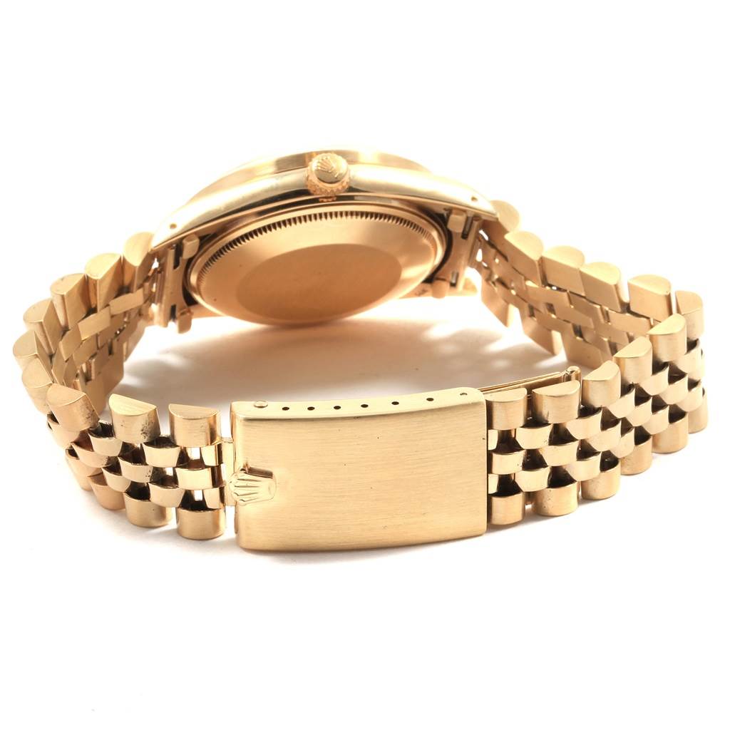 This image shows the back and side view of a Rolex Vintage Collection 15017 Men's Yellow Gold White Dial 15017 Men's Yellow Gold White Dial watch, including the case back, crown, and bracelet clasp.