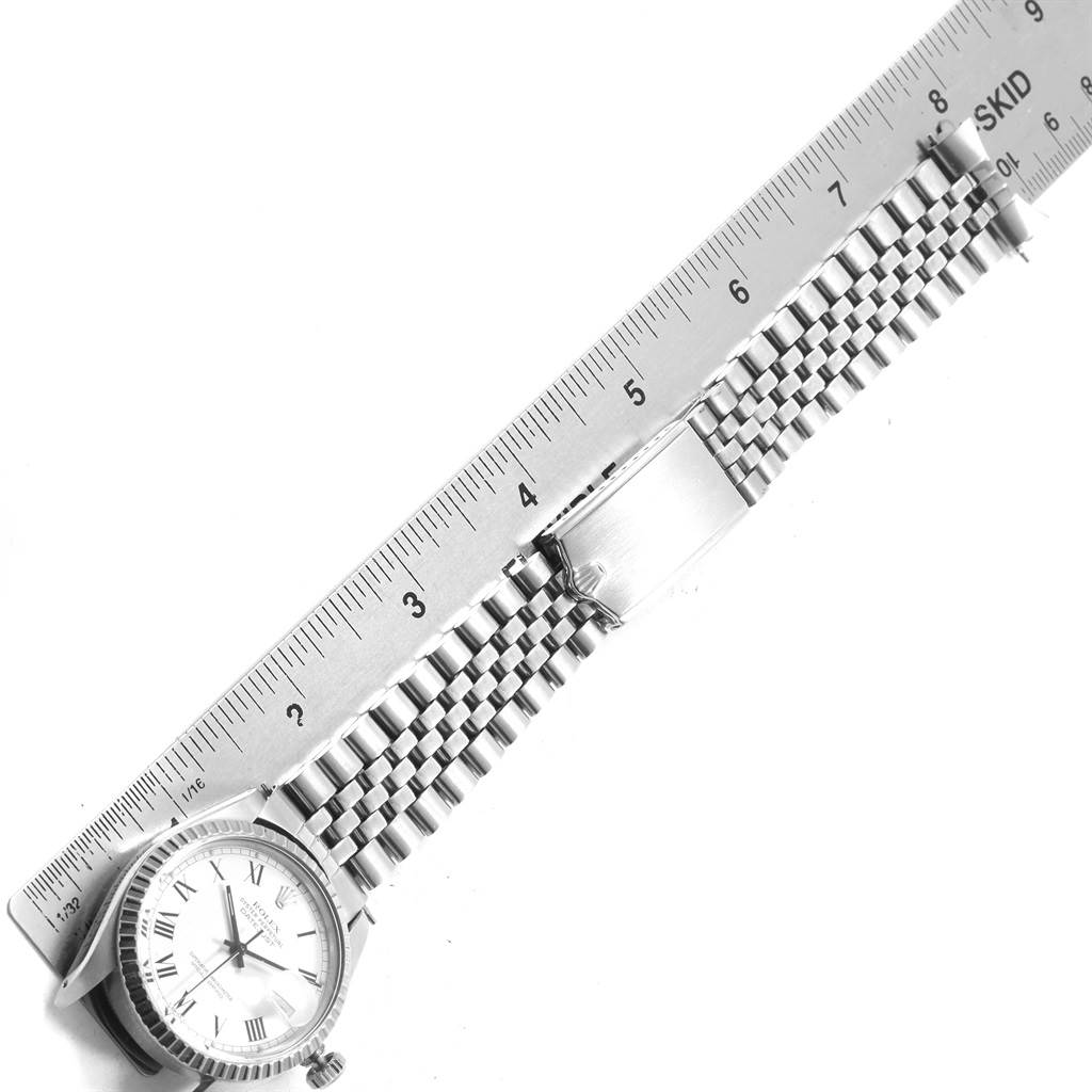 This image of the Rolex Vintage Collection 16030 Men
s Stainless Steel White Dial 16030 Men
s Stainless Steel White Dial model shows the watch face, band, and buckle alongside a measuring ruler.