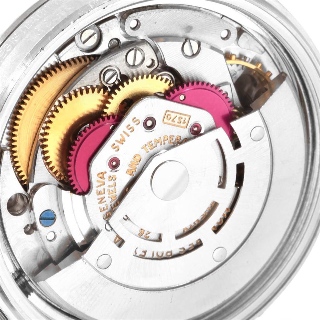 This image shows the intricate inner mechanical components of the Rolex Vintage Collection 1603 Men
s Stainless Steel Silver Dial 1603 Men
s Stainless Steel Silver Dial watch movement from a close-up angle.