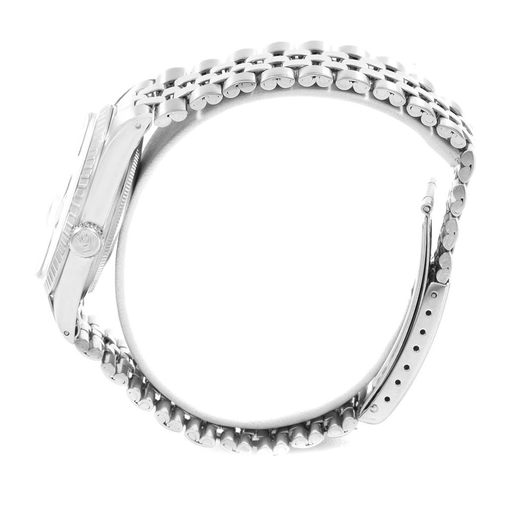 The image shows a side view of the Rolex Vintage Collection 1603 Men
s Stainless Steel Silver Dial 1603 Men
s Stainless Steel Silver Dial watch, highlighting its case, crown, and bracelet.