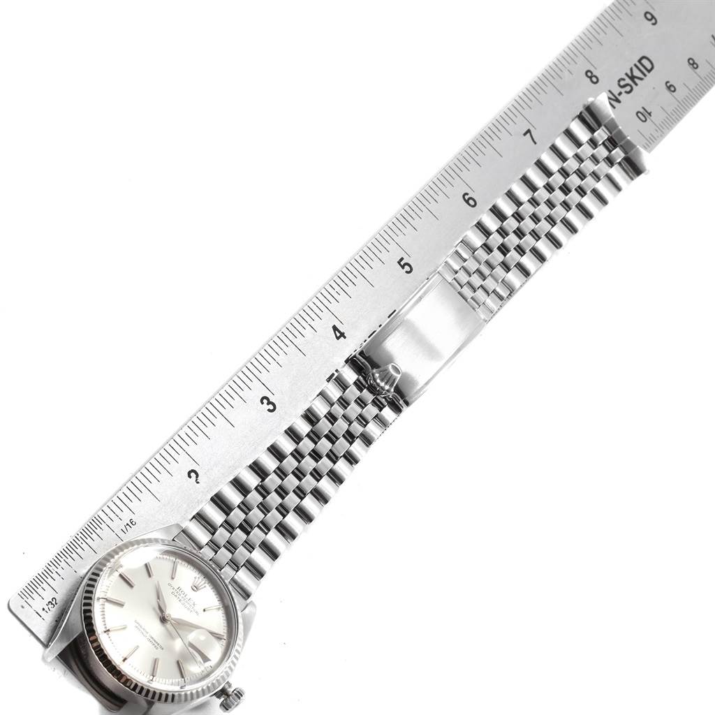 This image shows a Rolex Vintage Collection 1601 Men's Stainless Steel Silver Dial 1601 Men's Stainless Steel Silver Dial watch, displaying the face, bezel, and part of its metal strap from an angled top-down view.