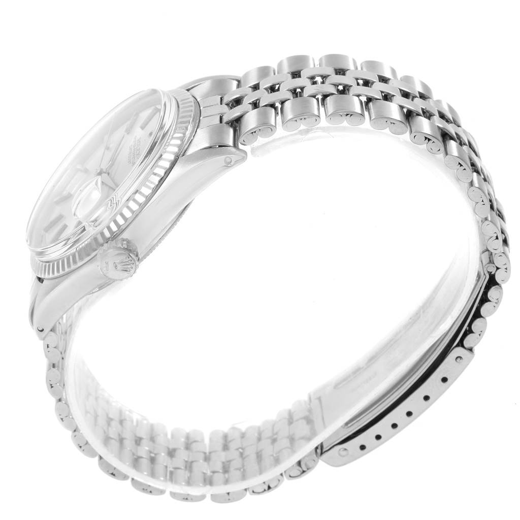 The image shows the side and partial top view of a Rolex Vintage Collection 1601 Men's Stainless Steel Silver Dial 1601 Men's Stainless Steel Silver Dial watch, highlighting the bezel, crown, and bracelet.