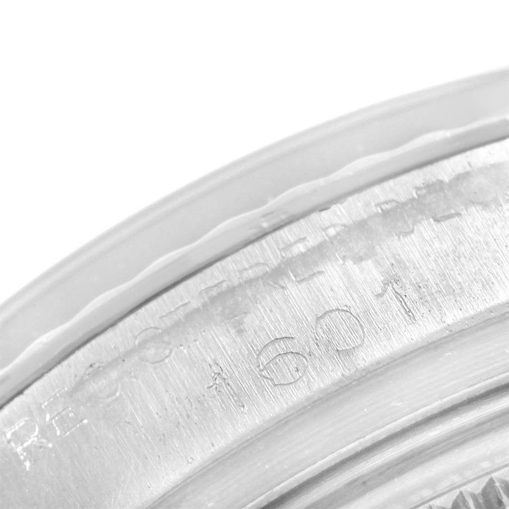 The close-up image shows the engraved bezel and serial number area of the Vintage Collection model by Rolex.