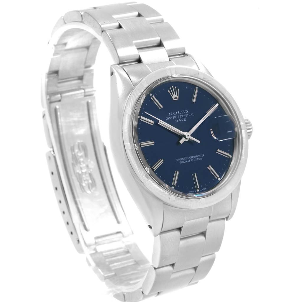The image shows a side angle of the Rolex Vintage Collection 1501 Men
s Stainless Steel Blue Dial 1501 Men
s Stainless Steel Blue Dial Oyster Perpetual Date watch, highlighting its metal bracelet and blue dial.