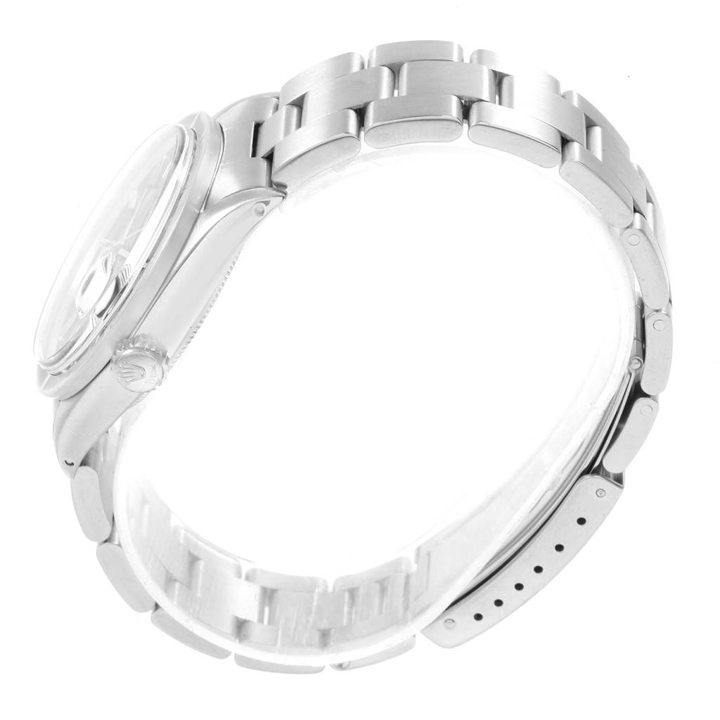 The image shows a side view of the Rolex Vintage Collection 1501 Men
s Stainless Steel Blue Dial 1501 Men
s Stainless Steel Blue Dial watch, highlighting its stainless steel case, bracelet, and crown.