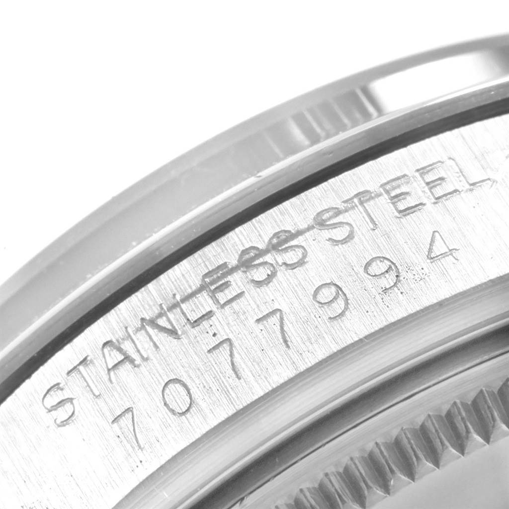 This image shows a close-up of the engraved stainless steel case back of a Rolex Vintage Collection 15000 Men's Stainless Steel Silver Dial 15000 Men's Stainless Steel Silver Dial model watch.