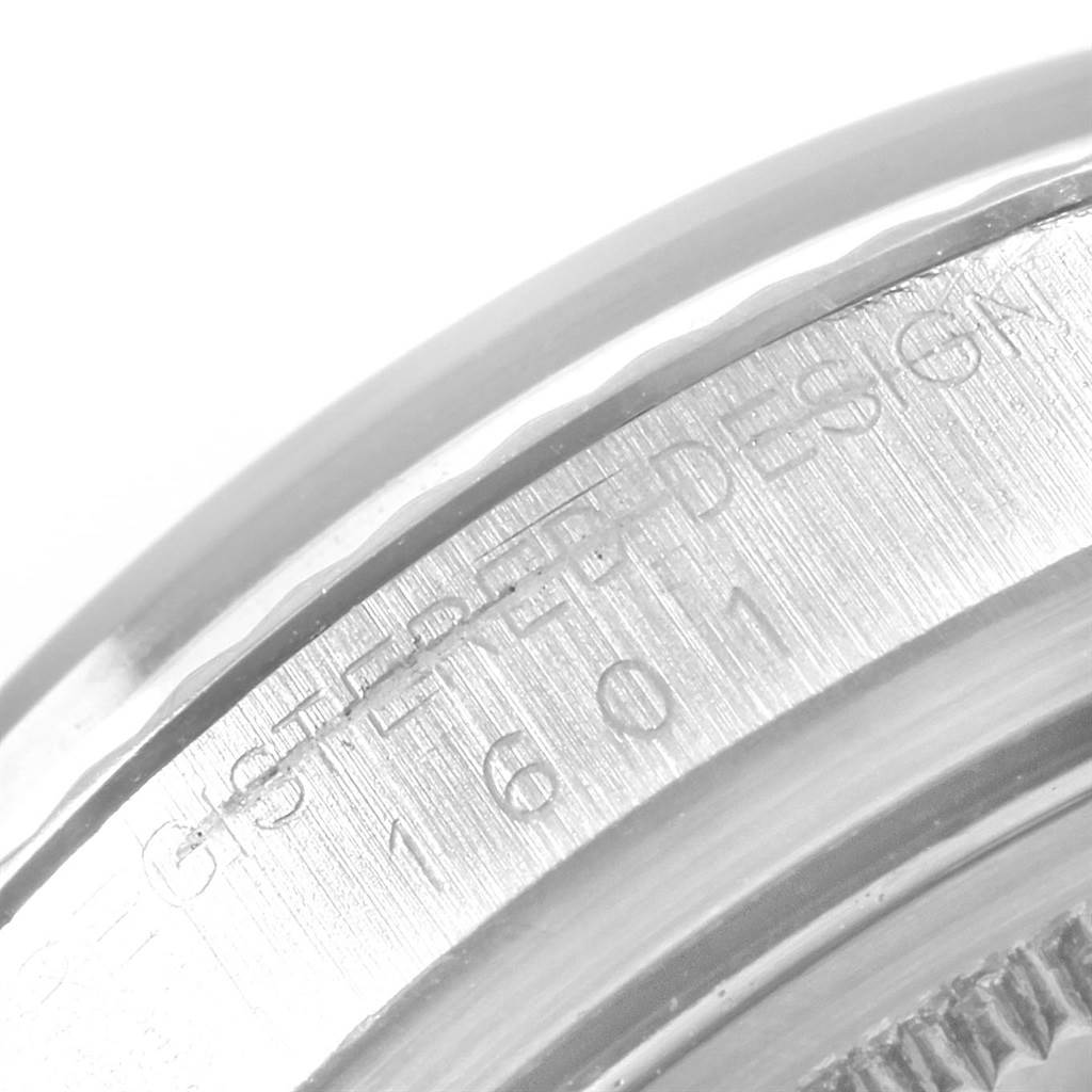 The image shows a close-up of the case side of a Rolex Vintage Collection 1601 Men's Stainless Steel Silver Dial 1601 Men's Stainless Steel Silver Dial watch, highlighting the model number engraving.