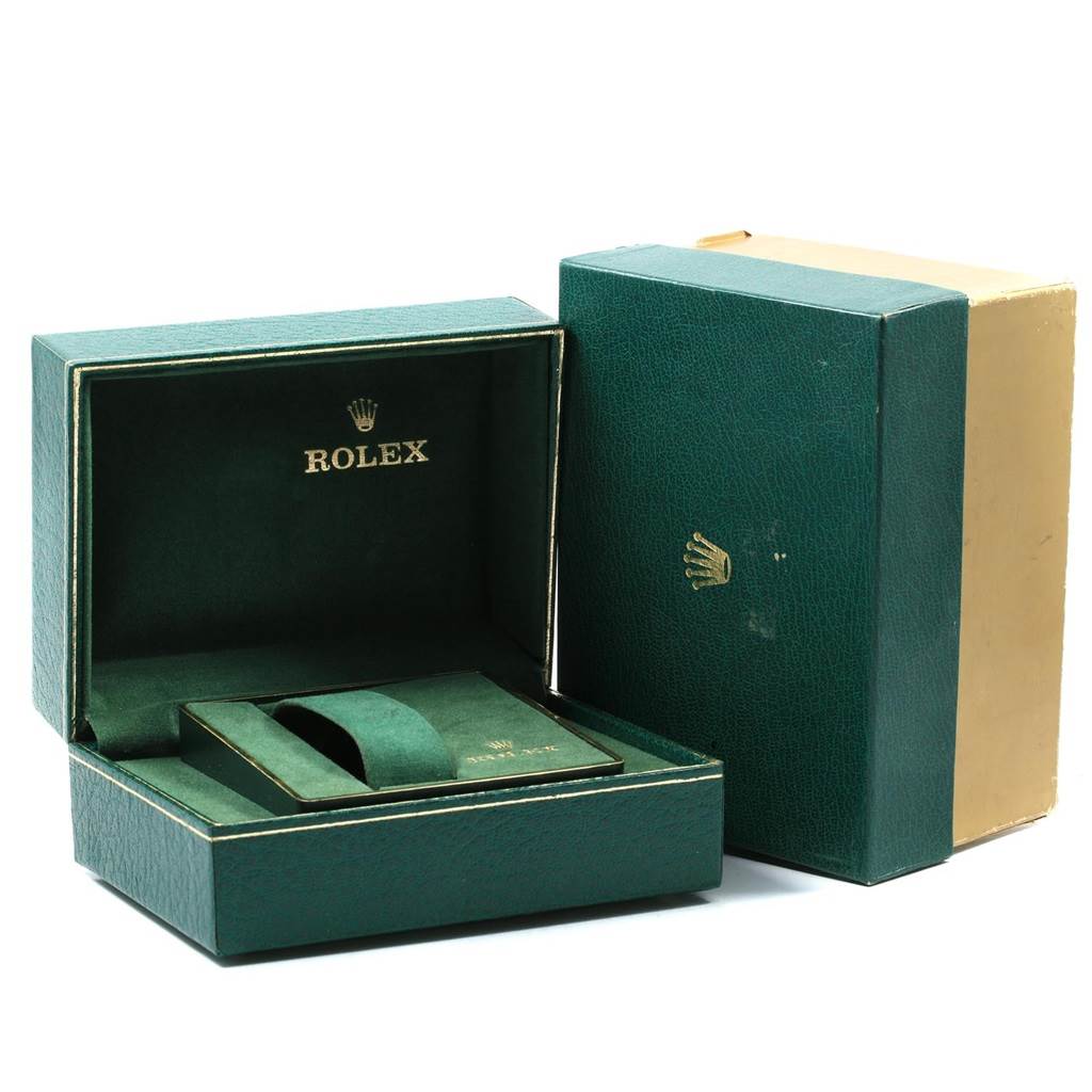 The image shows an open box and an outer case for a Vintage Collection watch by Rolex, showcasing the packaging.