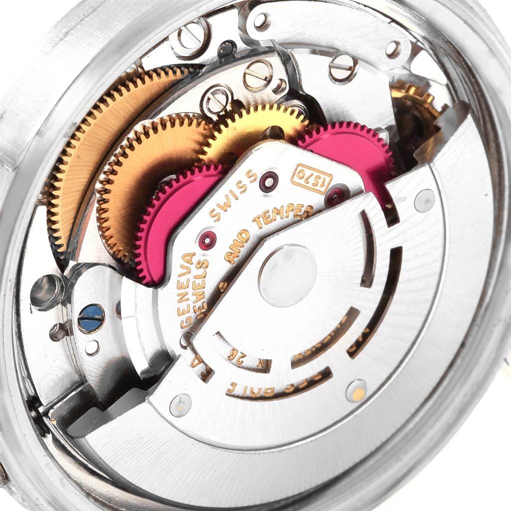 This image shows the intricate internal mechanism of a Rolex Vintage Collection 1601 Men's Stainless Steel Silver Dial 1601 Men's Stainless Steel Silver Dial watch from a close-up bottom view.