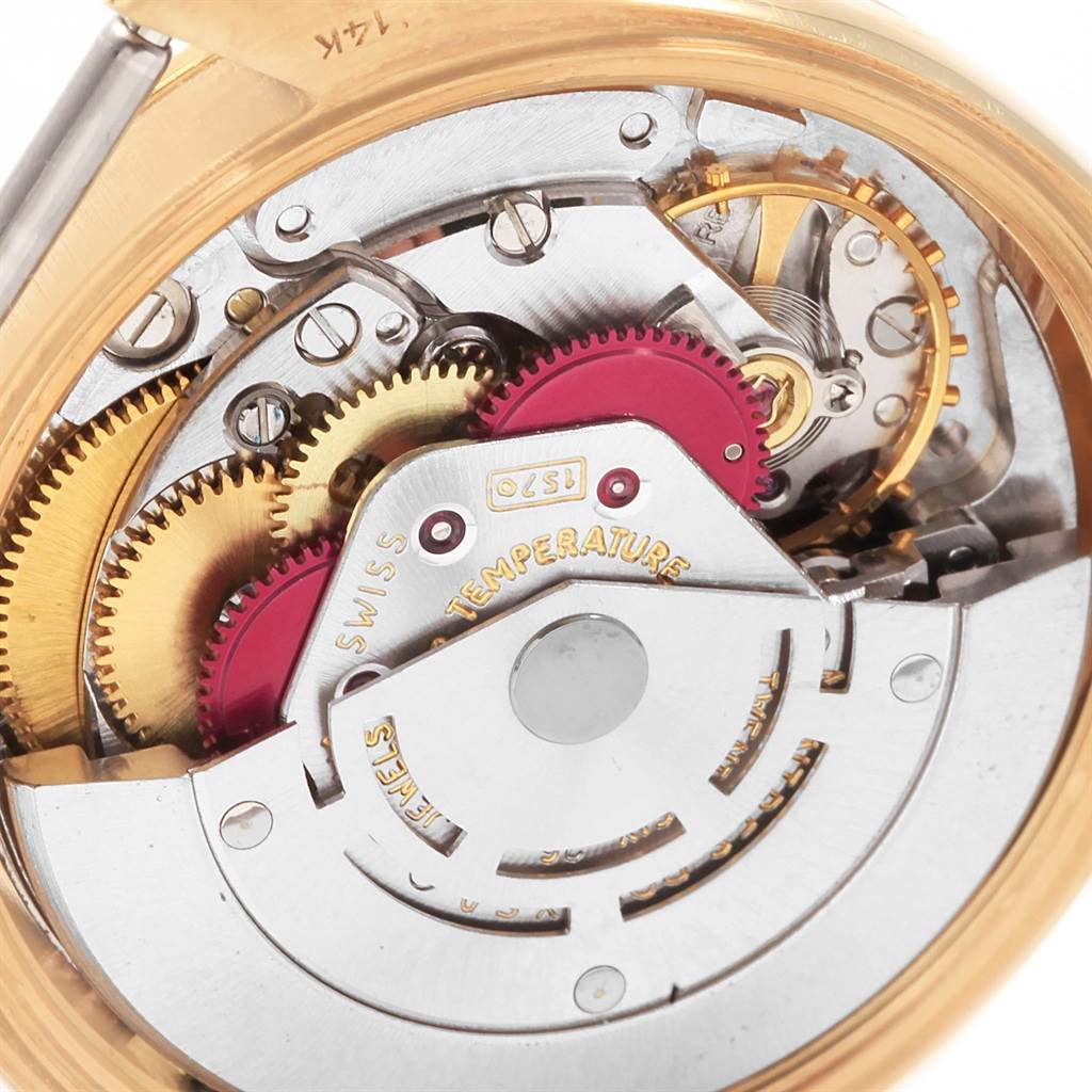 The image shows a close-up of the intricate inner mechanism of the Rolex Vintage Collection 1503 Men
s Yellow Gold Champagne Dial 1503 Men
s Yellow Gold Champagne Dial watch.