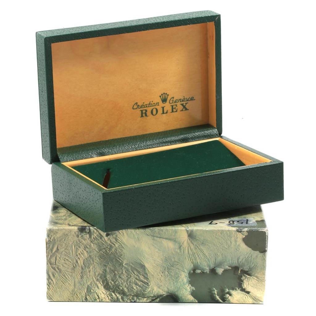 This image shows an open Rolex Vintage Collection 1002 Men's Yellow Gold Silver Dial 1002 Men's Yellow Gold Silver Dial watch box at an angle, revealing the interior.